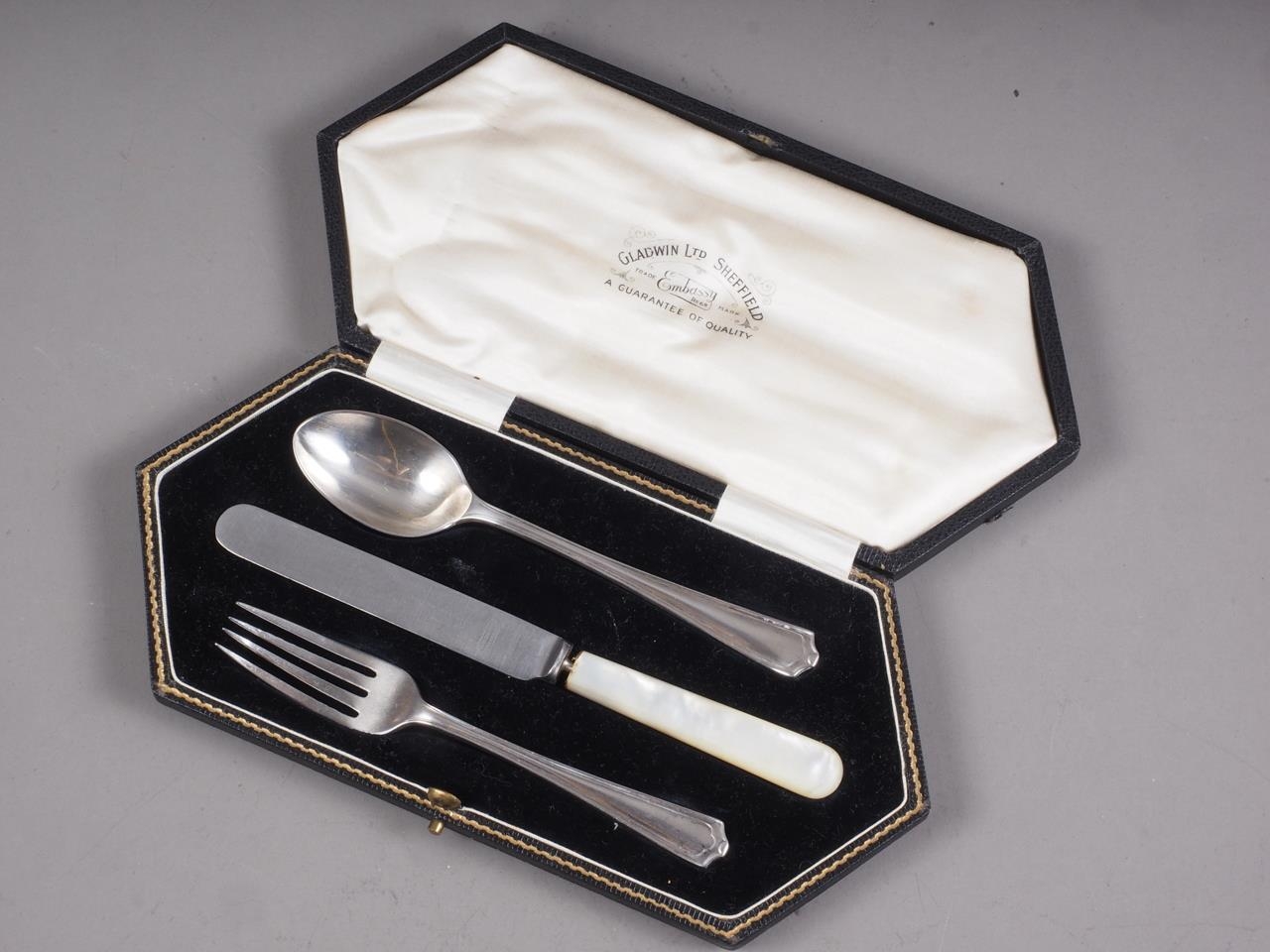 A silver fork and spoon and similar knife, in fitted case, and a set of six silver handled fruit