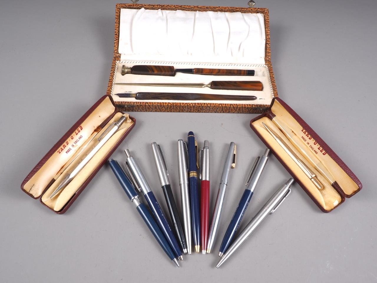 A Yard-O-Led propelling pencil, a rolled gold Yard-O-Lette propelling pencil, a desk set, and a