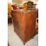 A bachelor's mahogany chest, comprising drop down writing flap, drawers, faux drawers and wardrobe