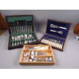 An oak canteen of silver plated fish knives and forks for twelve with composition handles, a
