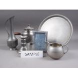A quantity of pewter, including trays, teapots, a page blotter, a tobacco jar, a sardine dish and