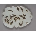 A Chinese "mutton-fat" jade carved, pierced and engraved plaque, decorated dragon, bats, etc, 2 1/2"