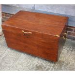 A stained pine hinged trunk with brass handles, 35" wide