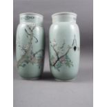 A pair of Chinese celadon glazed and bird decorated cylinder vases, 12 1/4" high (now drilled as