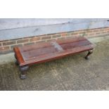 A carved mahogany long low stool, on cabriole claw and ball supports, 15" wide x 40" deep x 12" high