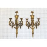 A pair of late 18th century ormolu three-branch wall lights with eagle heads, acanthus scrolls and