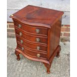 A mahogany serpentine front four drawer chest, on cabriole supports, 24" wide x 14" deep x 24" high