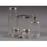 Five cut glass dressing table jars with silver lids