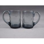 A pair of Whitefriars smoked glass mugs, 4 1/2" high (one with crack)