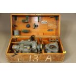 A vintage theodolite, by Cooke, Troughton & Simms, in wooden travel case
