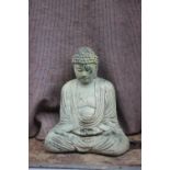 A cast stone seated Buddha, on plinth, 21" high