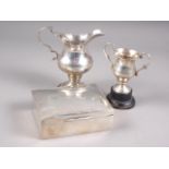 A 19th century silver cream jug, a silver miniature trophy, 3.98oz troy approx, and a silver