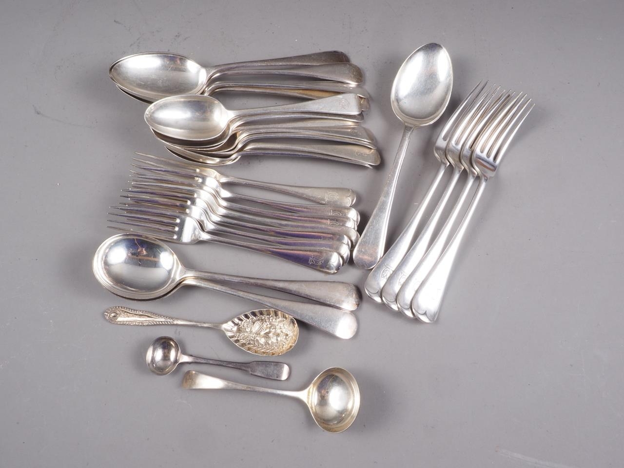 Two silver tablespoons, monogrammed "L", four matching dessert spoons, three other silver dessert