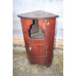 A mahogany bowfront corner cupboard recess over one drawer, on bracket feet, 18 1/2" wide x 13" deep