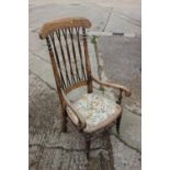 An early 20th century Windsor five-lath back elbow chair, on turned supports