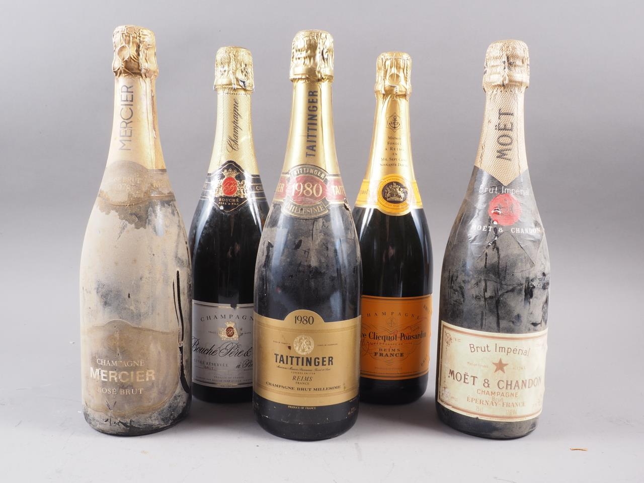 Five bottles of champagne, comprising Taittinger, Moet & Chandon, Veuve Clicquot, Mercier & Rouche