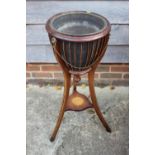 An Edwardian mahogany and box line inlaid jardiniere stand with lion masks and brass swags and line,