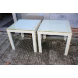 A pair of cream and yellow painted lamp tables, on square supports, 22" wide x 22" deep x 20" high