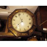 An early 19th century mahogany and brass inlaid octagonal wall clock with painted dial and single