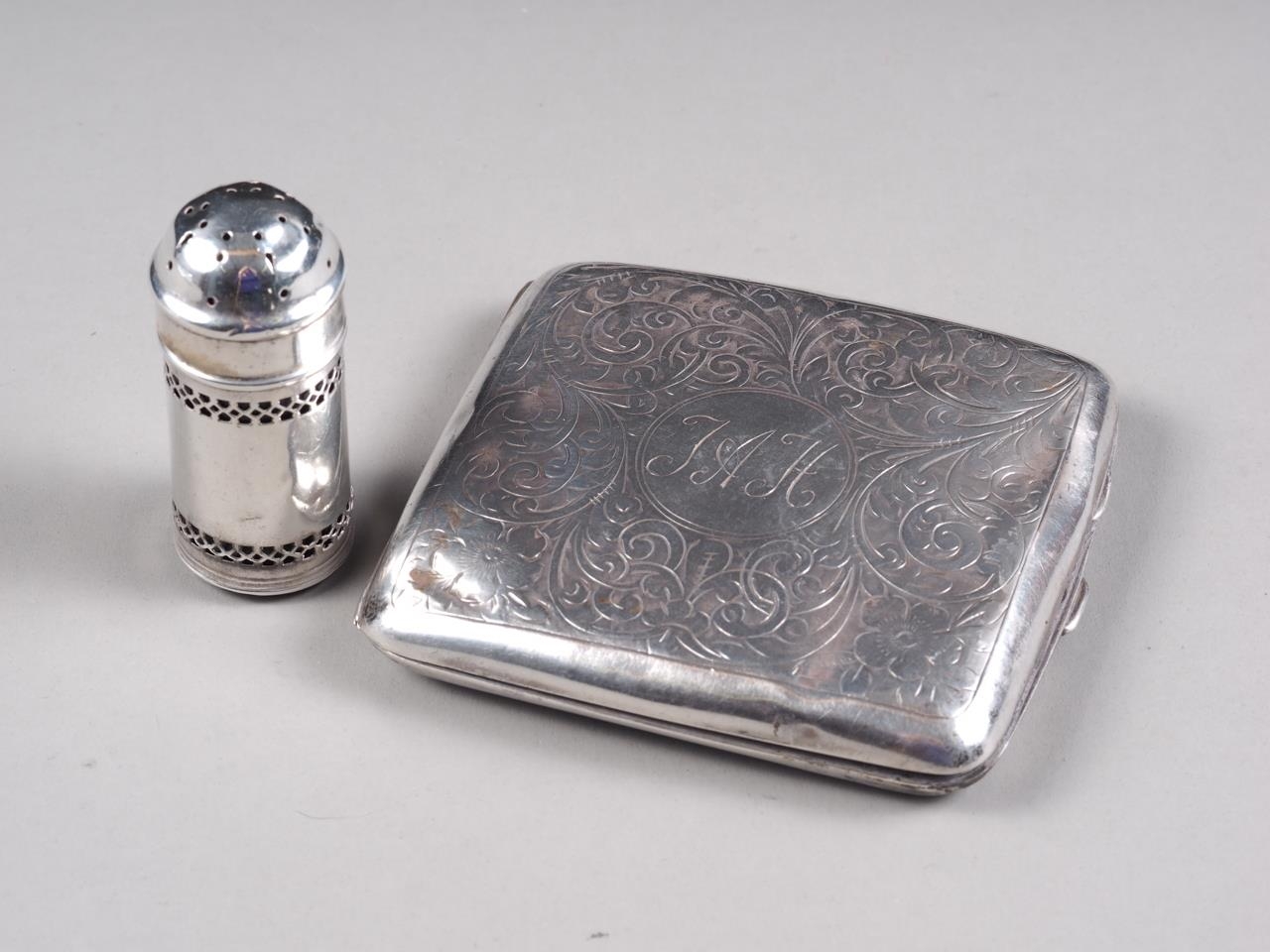 A silver cigarette case and a silver pepper shaker, 3.3oz troy approx