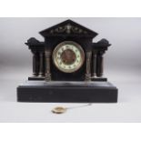 A French black marble clock with eight-day striking movement, 13 1/2" high, and a Vienna walnut