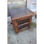 A mid 20th century hardwood spindle fronted cupboard, 24" high