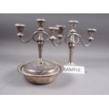Three silver plated two-branch candelabra, 9 1/4" high, two other similar candelabra, a pierced bowl