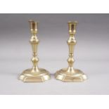 A pair of 18th century seamed brass candlesticks, 6 1/4" high