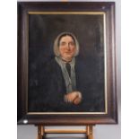 A mid 19th century oil on canvas portrait of a woman with clasped hands, 20 1/2" x 15 1/2", in oak