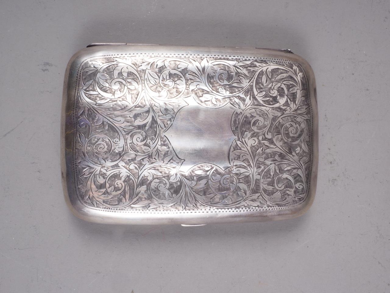 A silver fluted cigar case with engraved scroll decoration, 3.1oz troy approx