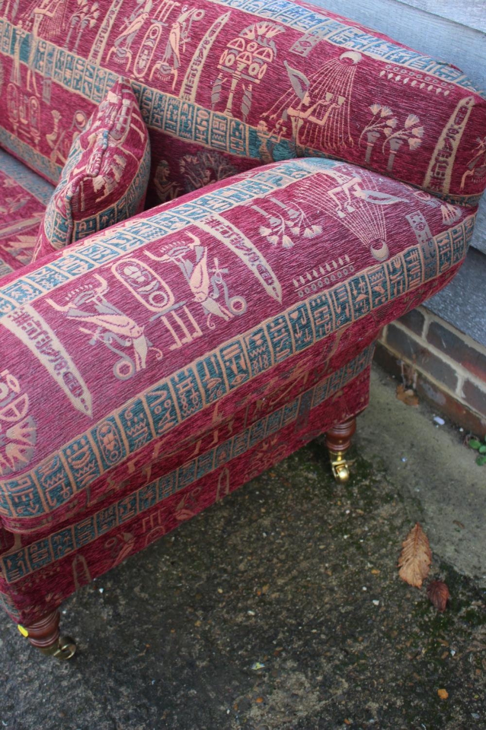 A two-seat scroll arm settee, upholstered in an Egyptian design fabric, on turned supports, 74" wide - Bild 3 aus 3