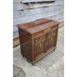 A French Louis XVI mahogany parquetry and gilt metal mounted side cupboard enclosed two doors, on