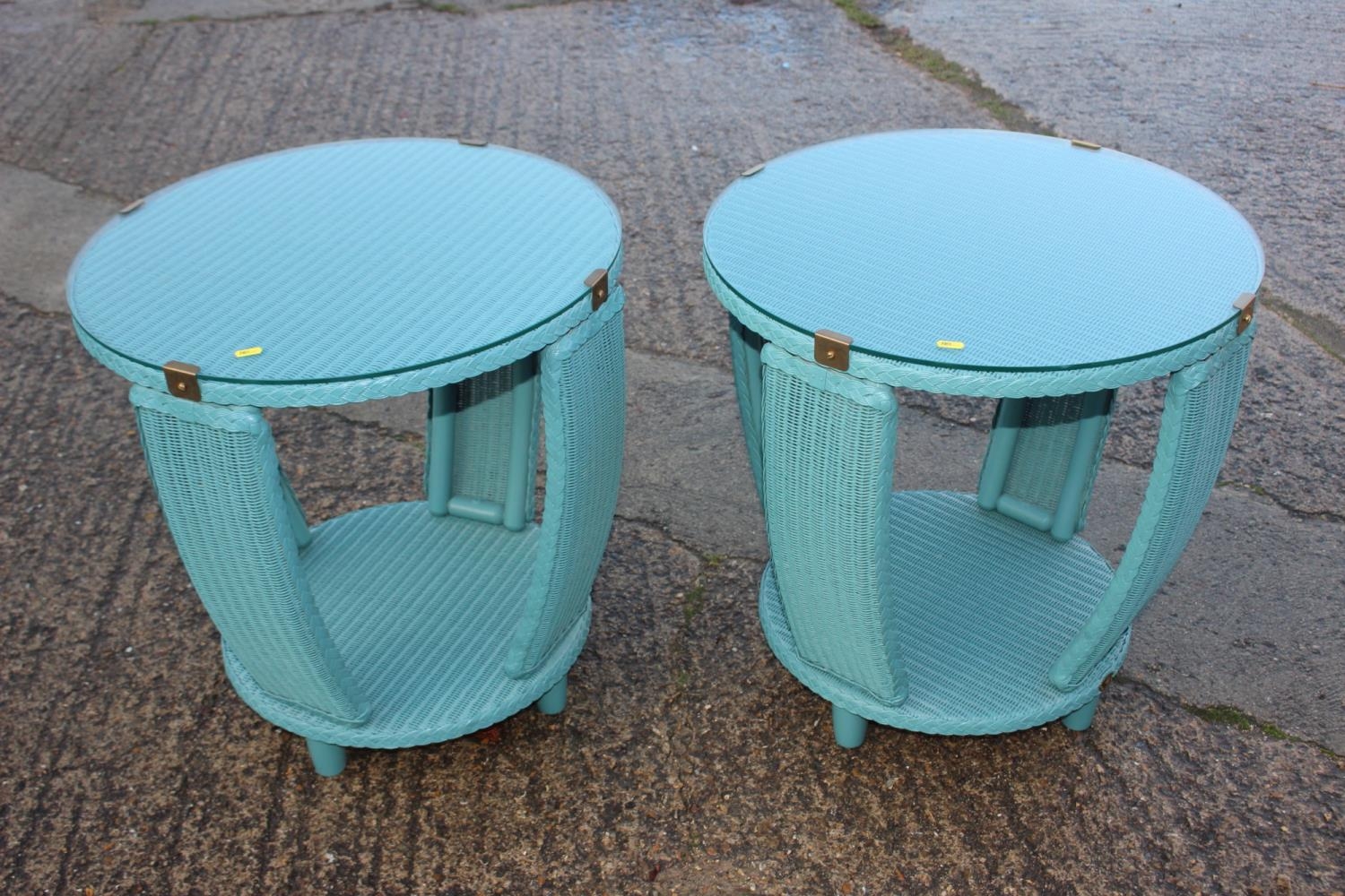 A pair of modern Lloyd Loom two-tier occasional tables with glass tops, 23" dia x 24" high