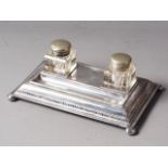 Three pairs of silver plated knife rests and a plated inkstand with inkwells