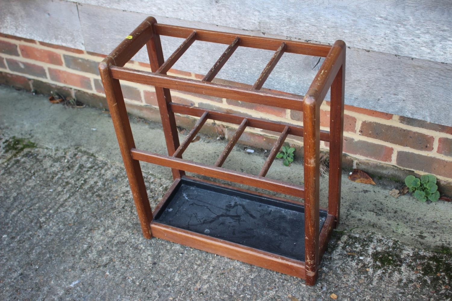 A 1930s mahogany stick stand, 20" wide