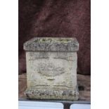 A cast stone planter with vase and swag decoration, 15" wide x 15" deep x 16" high