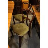 A pair of Victorian mahogany arch shaped back side chairs, upholstered in a green velour, on