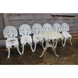 A cast aluminium garden table, 26" dia, and six cast aluminium seats