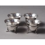 A set of four silver salt cellars with shaped rims, on cabriole supports, 4.7oz troy approx