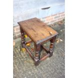 An oak joint stool of 17th century design, on turned and stretchered supports, 18" wide x 11 1/2"