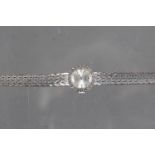 A lady's 18ct white gold Longines bracelet watch with diamond bezel, silvered dial and baton