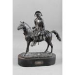 A 19th century patinated bronze figure of Napoleon mounted on a horse, 14" high, on oval ebonised