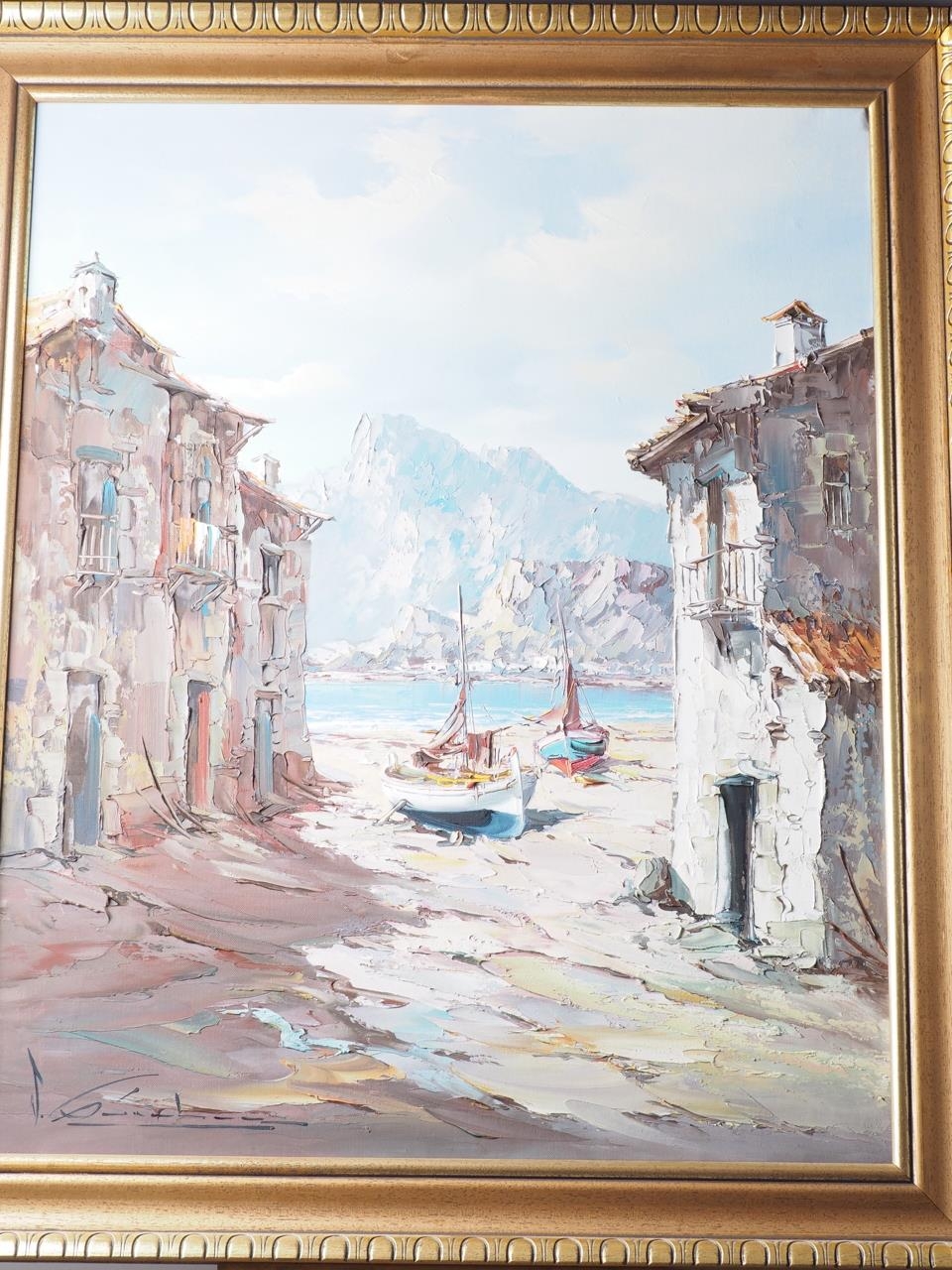 Continental School: a pair of oils, coastal scenes with houses, moored boats and distant