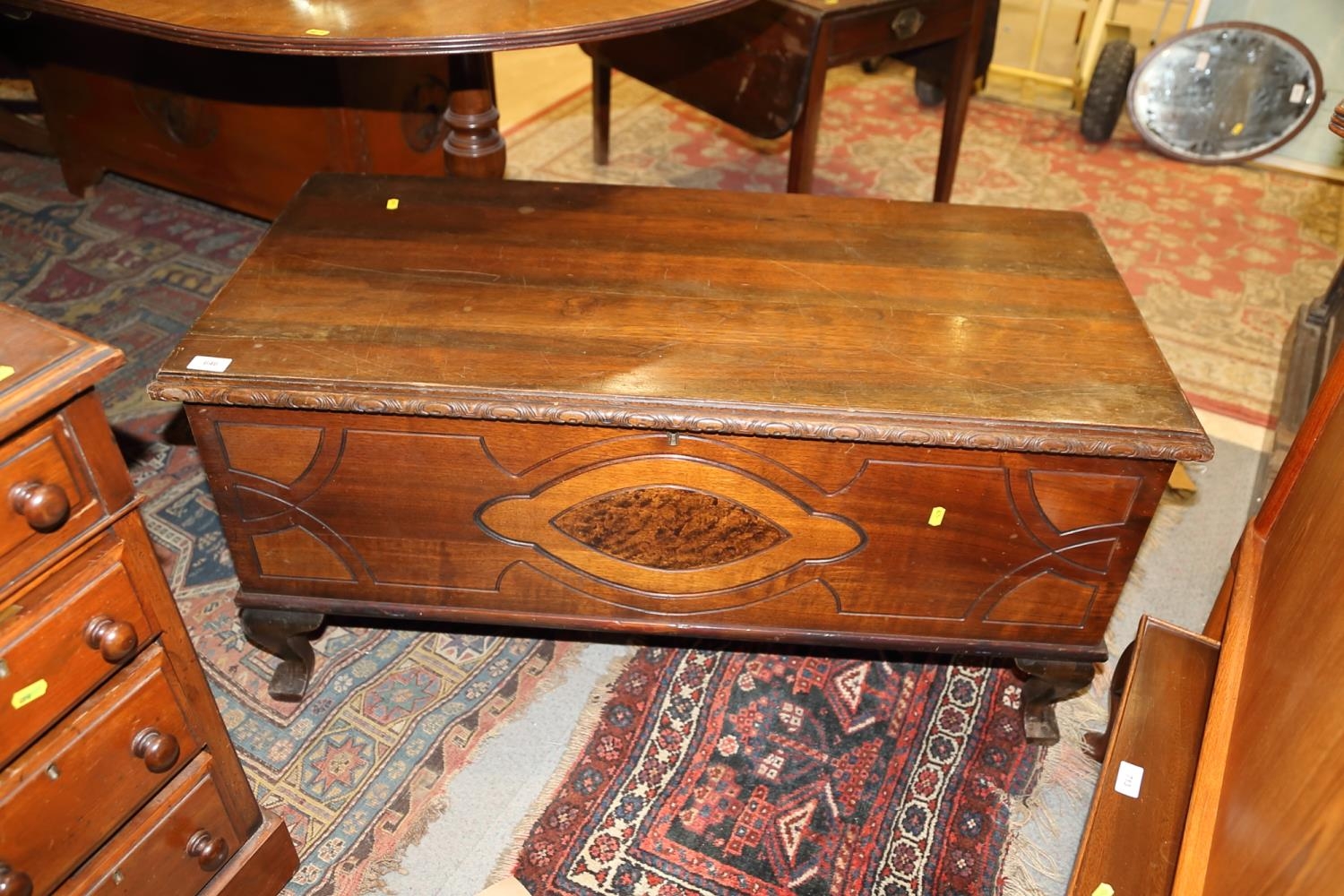 A 1930s oak and mahogany carved blanket box with cedarwood lining, 40" wide x 19" deep x 20" high