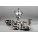 A pewter samovar, 17 3/4" high, a silver plated and glass condiment bottle set, a bottle stand and