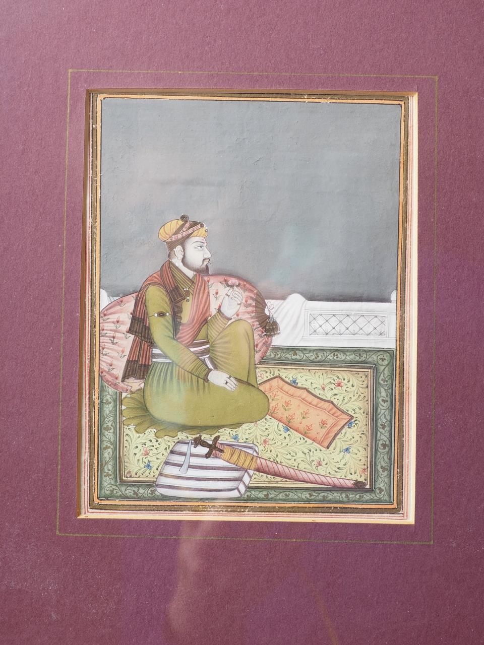 A Mughal School portrait of a prince seated on a rug, 5 1/2" x 4 3/8", in gilt frame