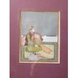 A Mughal School portrait of a prince seated on a rug, 5 1/2" x 4 3/8", in gilt frame