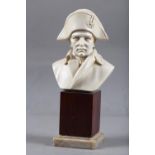 A composition portrait bust of the Emperor Napoleon, 5" high, on mahogany block base