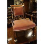 An Edwardian mahogany box and bone inlaid open armchair with low stuffed over seat, on square