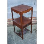 A plum pudding mahogany three-tier wash stand, fitted one drawer, on chamfered supports, 13"